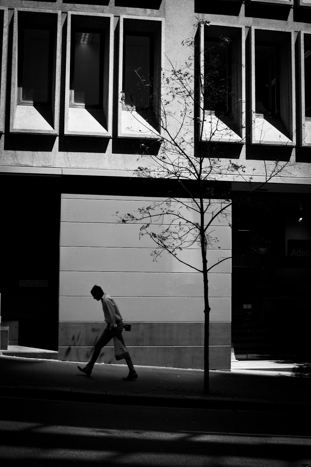 person walking on sidewalk