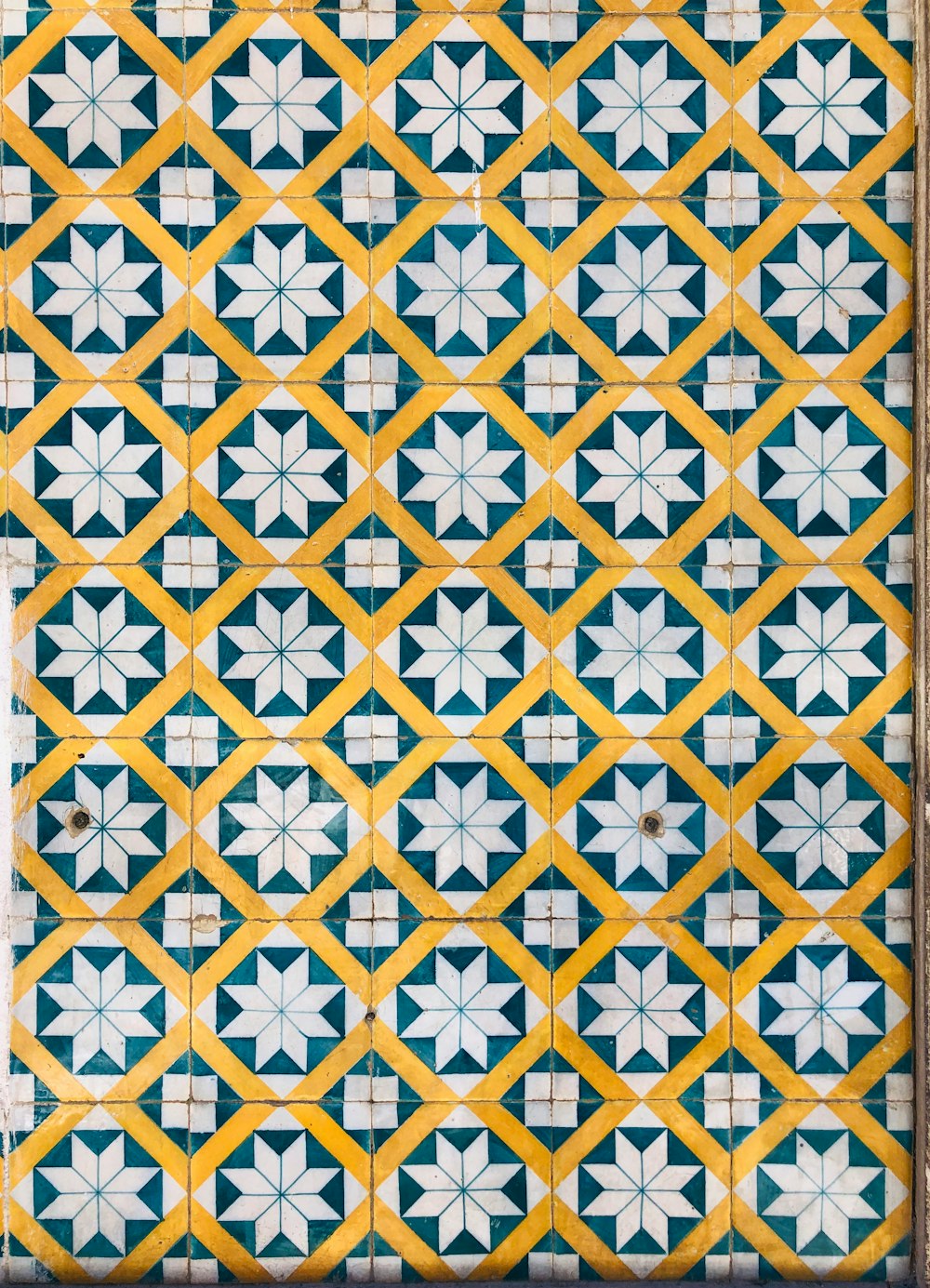 yellow and white floral textile