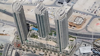 Aerial view of three high-rise buildings - Real estate opportunities for private investors #PrivateI