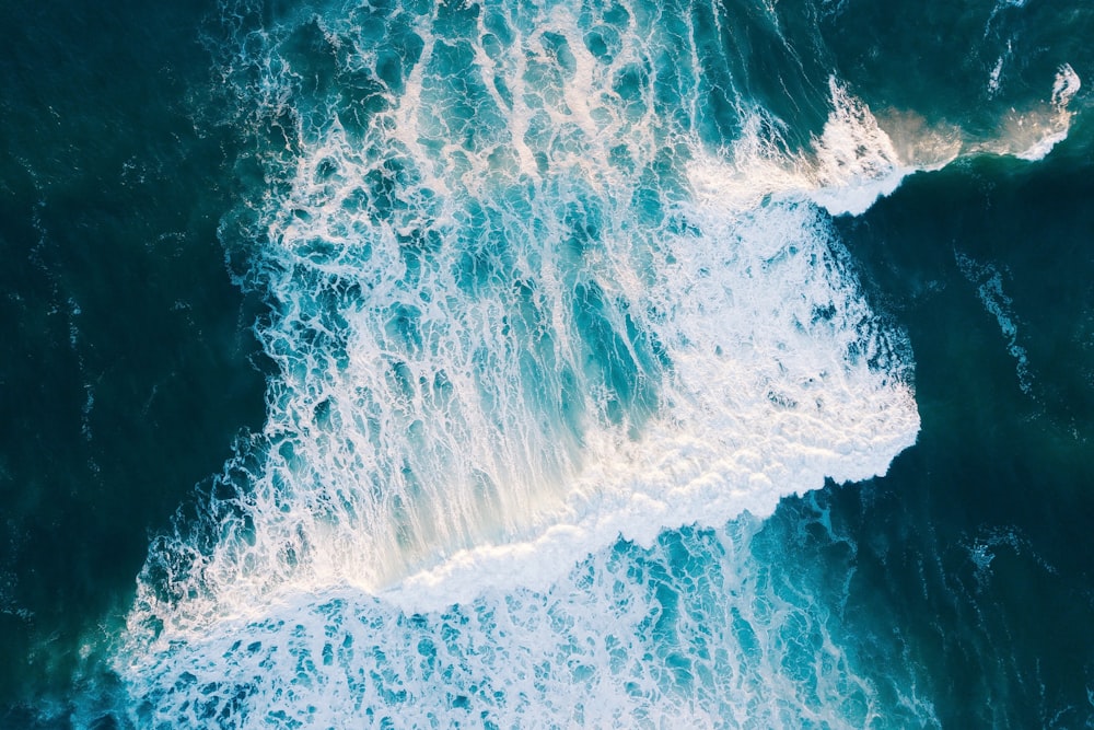 wavy body of water during daytime