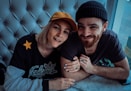 smiling man and woman taking selfie