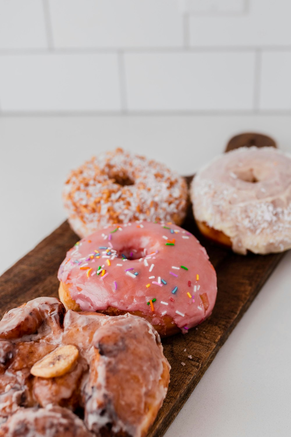 doughnuts on wooden tray