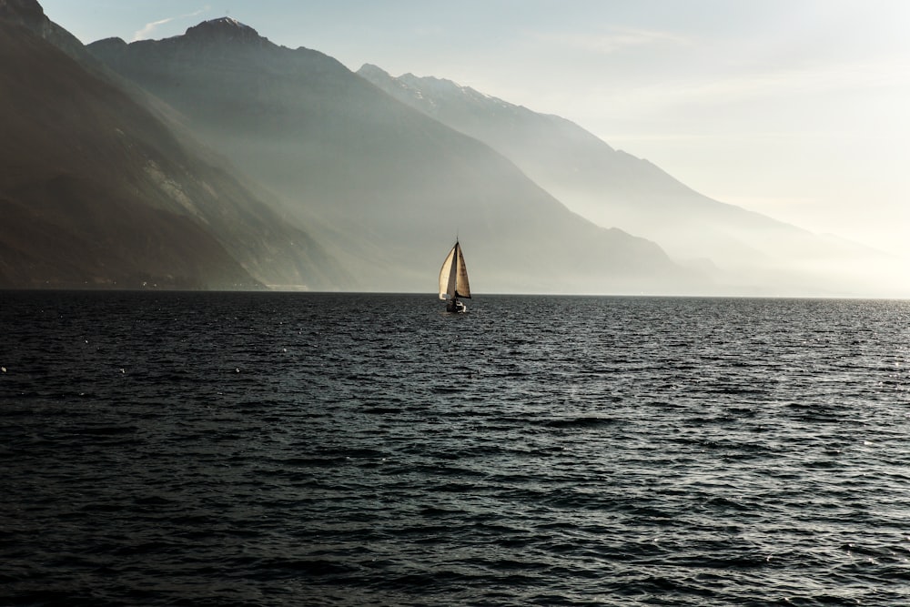 sailboat at the ocean surrounded with fog