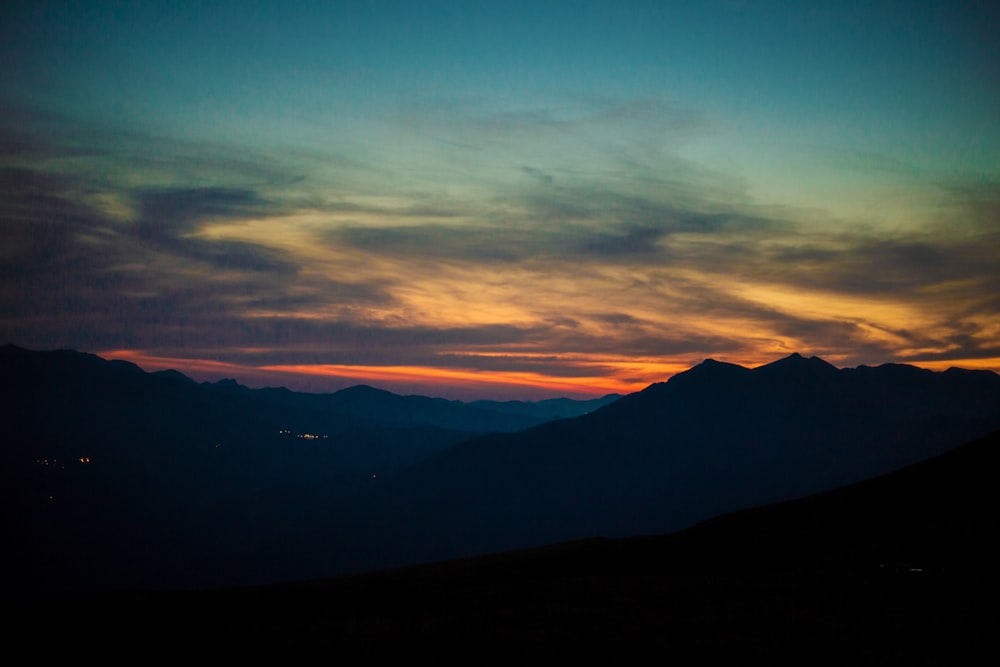 silhouette of mountain during sunset