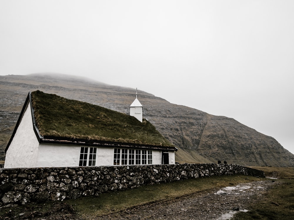 white church with rock wall