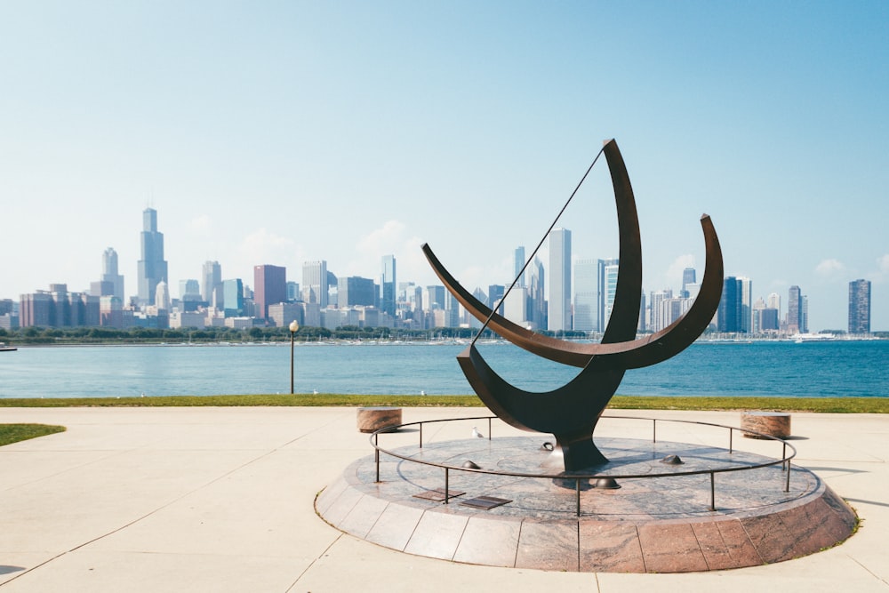 brown statue near body of water