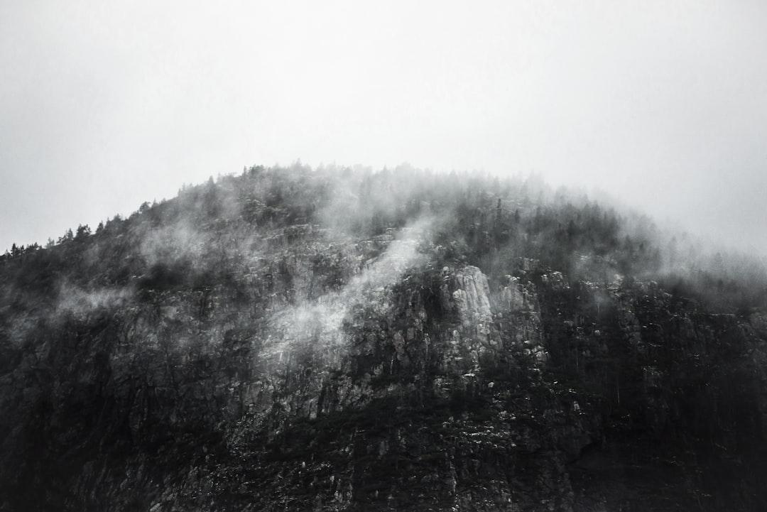 greyscale photography of mountain,