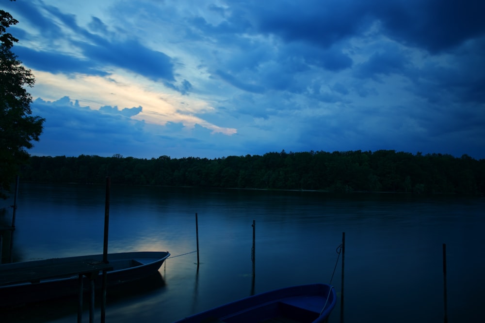 blue boat on body of water