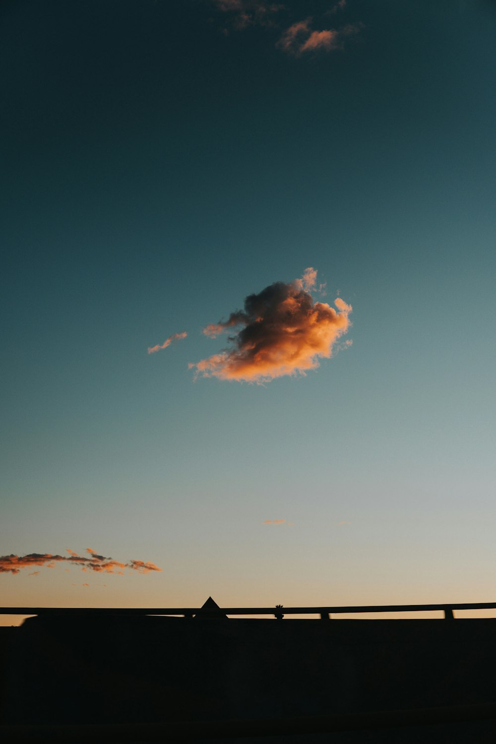 orange clouds in clear sky at dusk