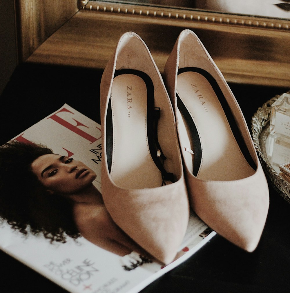 pair of beige suede stiletto shoes