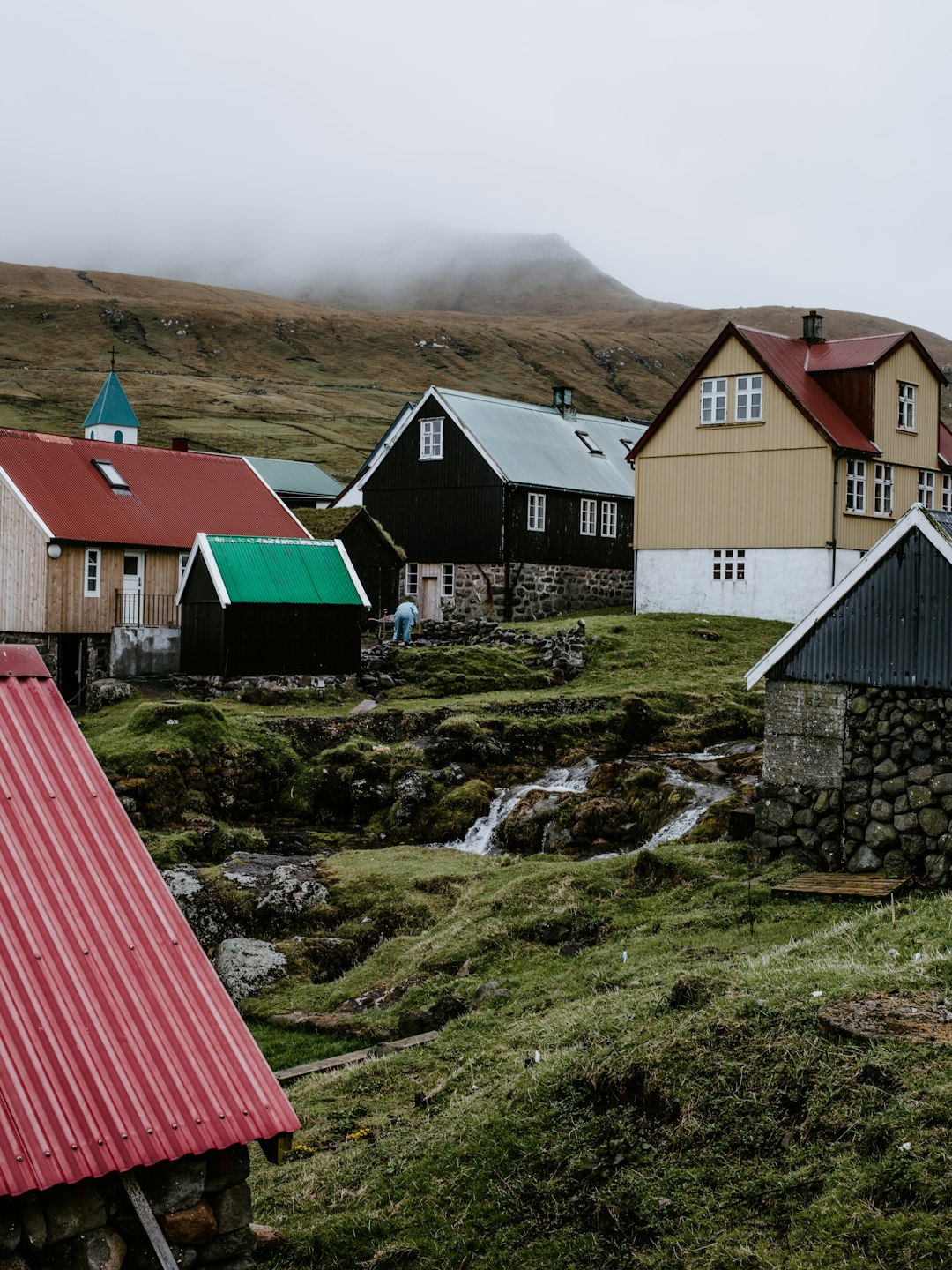 black and brown houses under by fogs during daytime