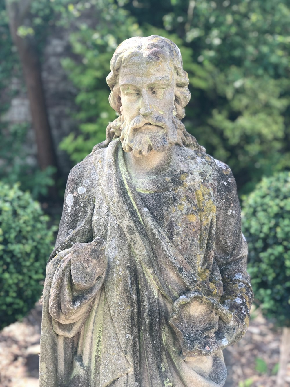 shallow focus photo of religious statue