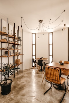 Cozy study room with dark grey concrete walls and minimalist decor.