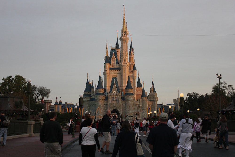 people walking towards castle