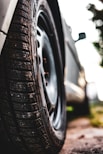 shallow focus photography of car tire