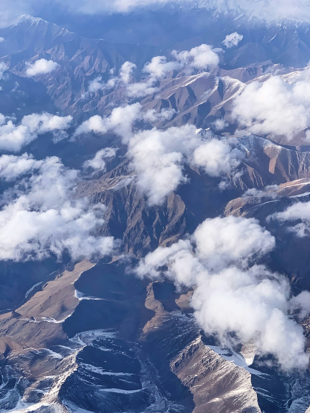 white clouds over mountains