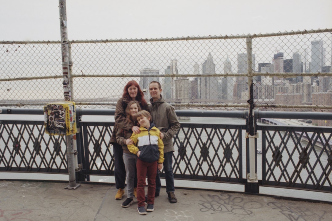 family standing beside wall