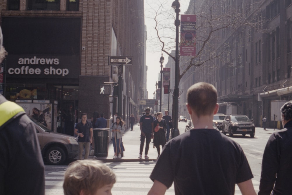 people crossing pedestrian lane during daytime