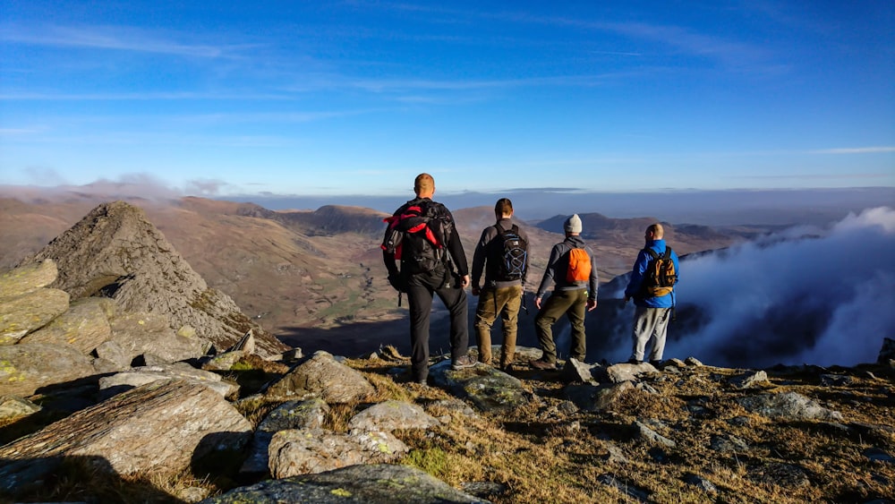 person standing on mountain during daytime