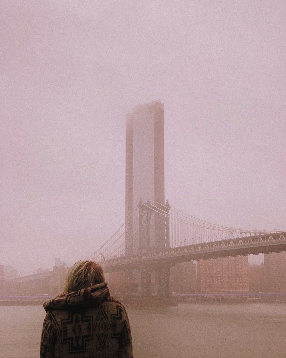 woman facing bridge