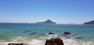 body of water under blue sky