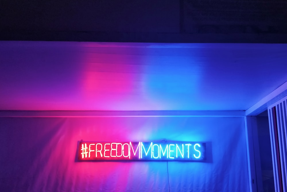 freedom moments neon light signage