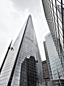 low angle photo of curtain gl;ass wall building