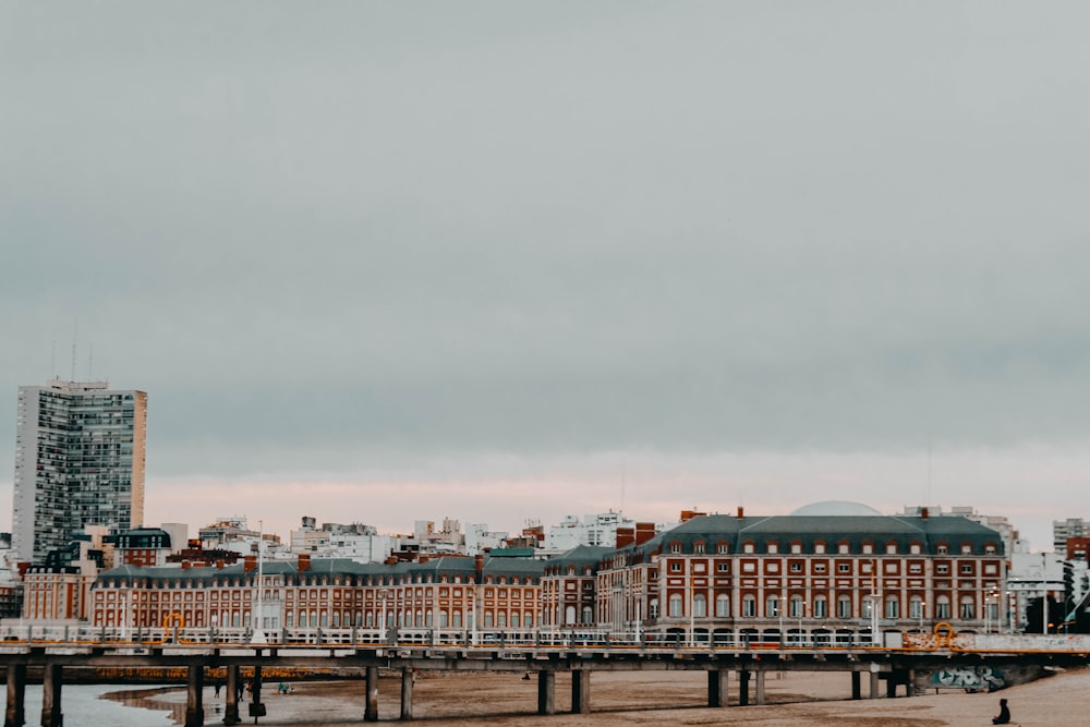 city buildings under cloudy sky