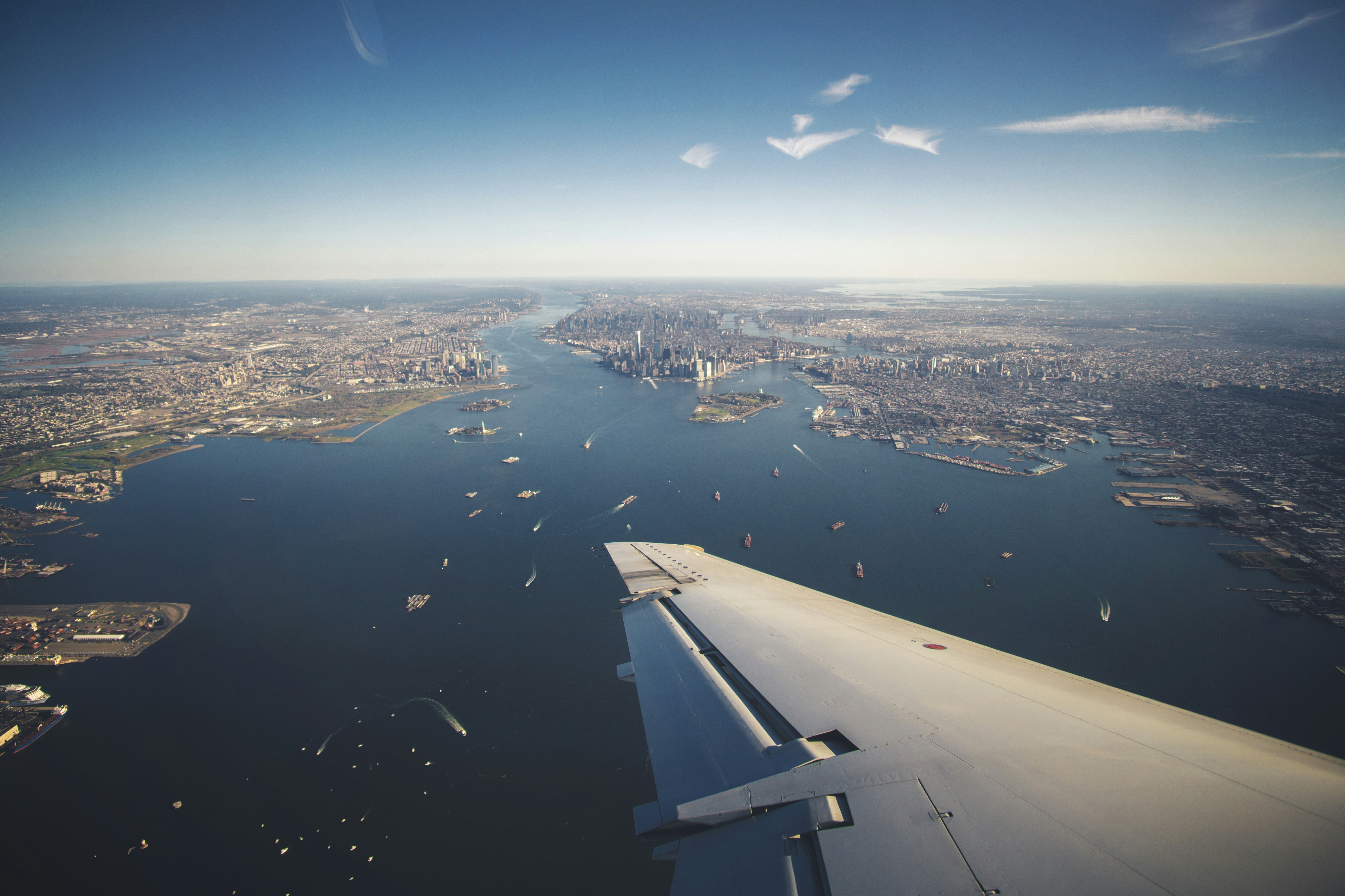 an aerial view of a city and a body of water, 