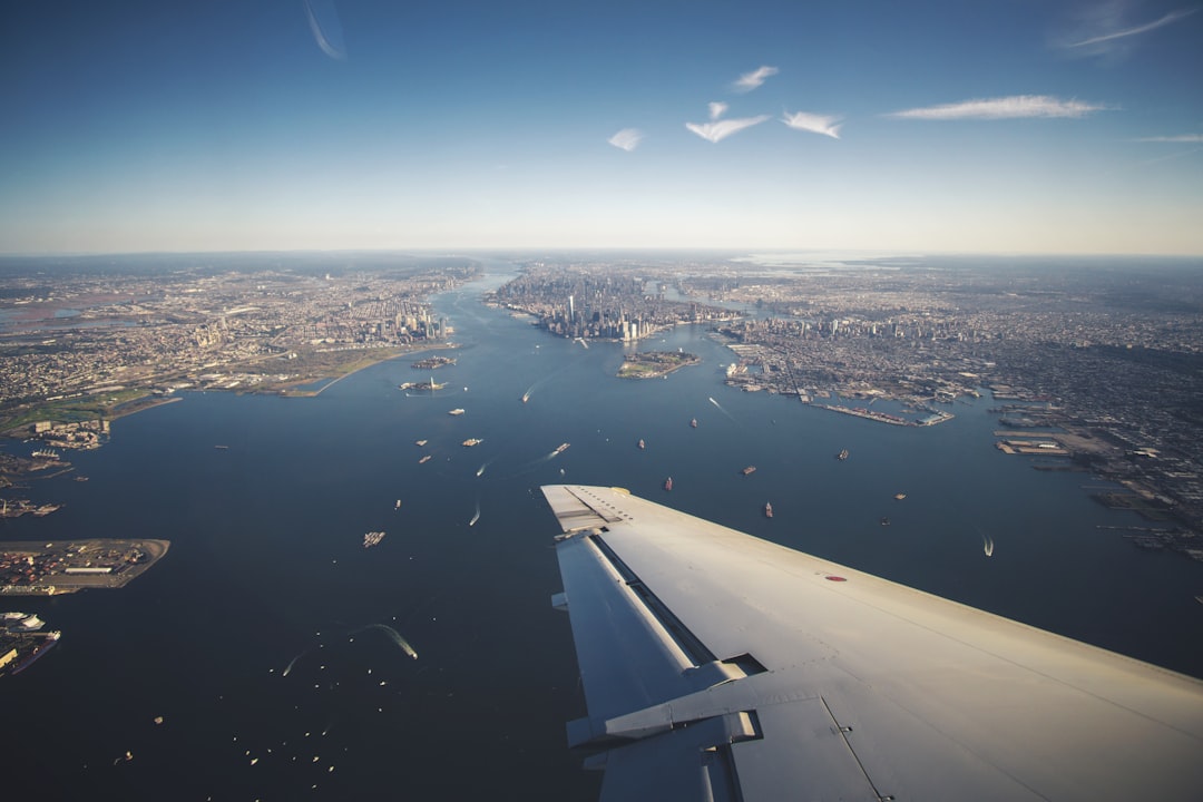an aerial view of a city and a body of water,