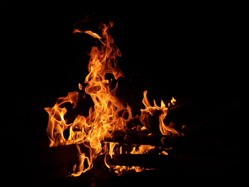 a close up of a fire in the dark