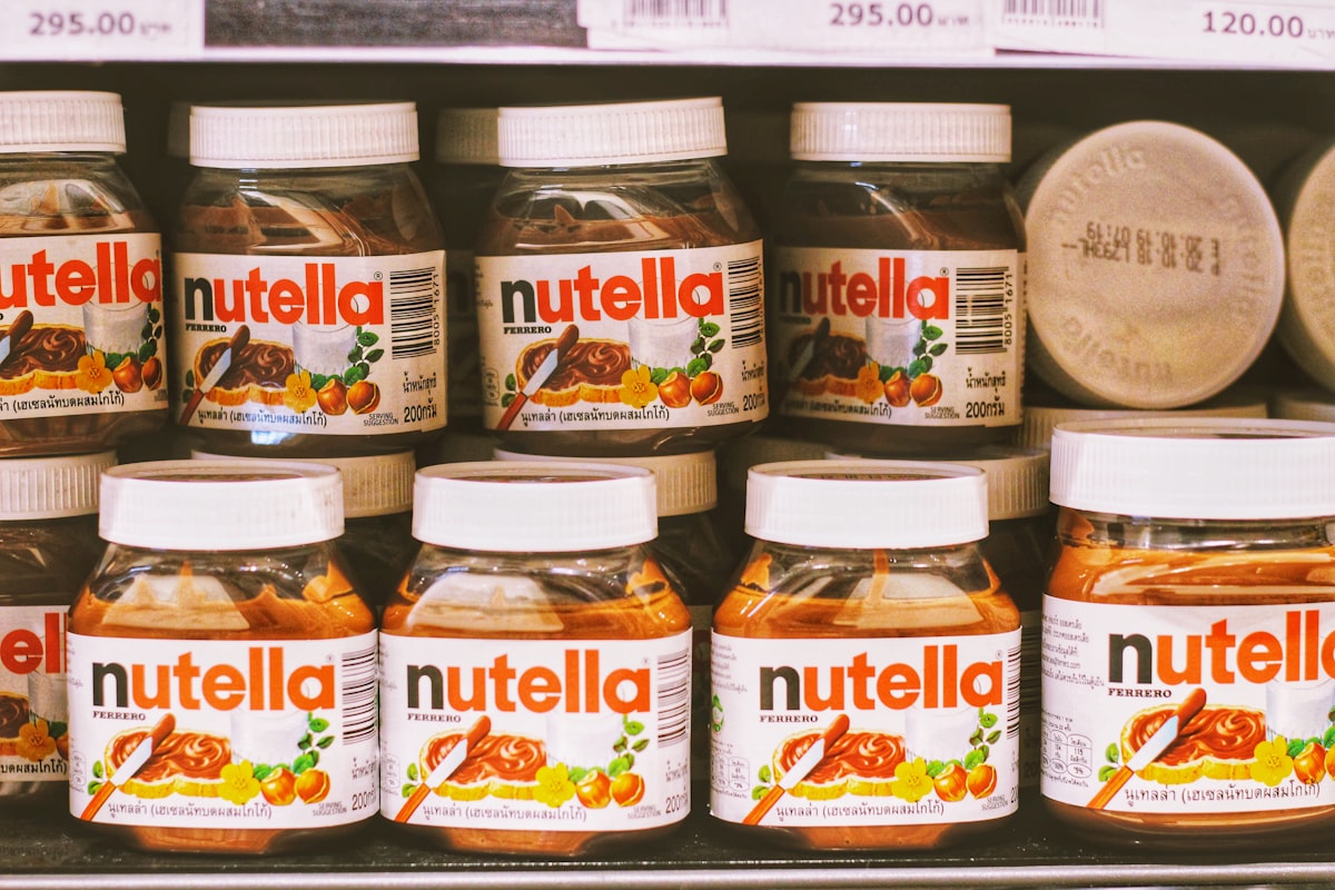 Stacked Nutella jars on a shelf