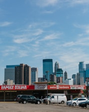 A local Orlando skyline view with a small business storefront in the foreground, capturing the community focus.