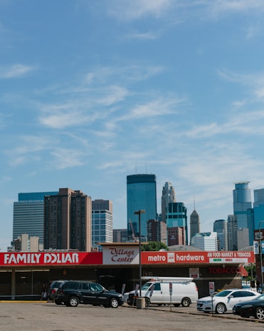 A local Orlando skyline view with a small business storefront in the foreground, capturing the community focus.