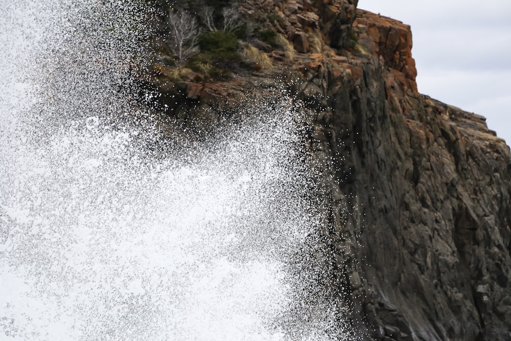 water splash across brown hill