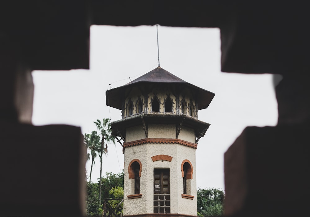 a tall tower with a clock on the top of it