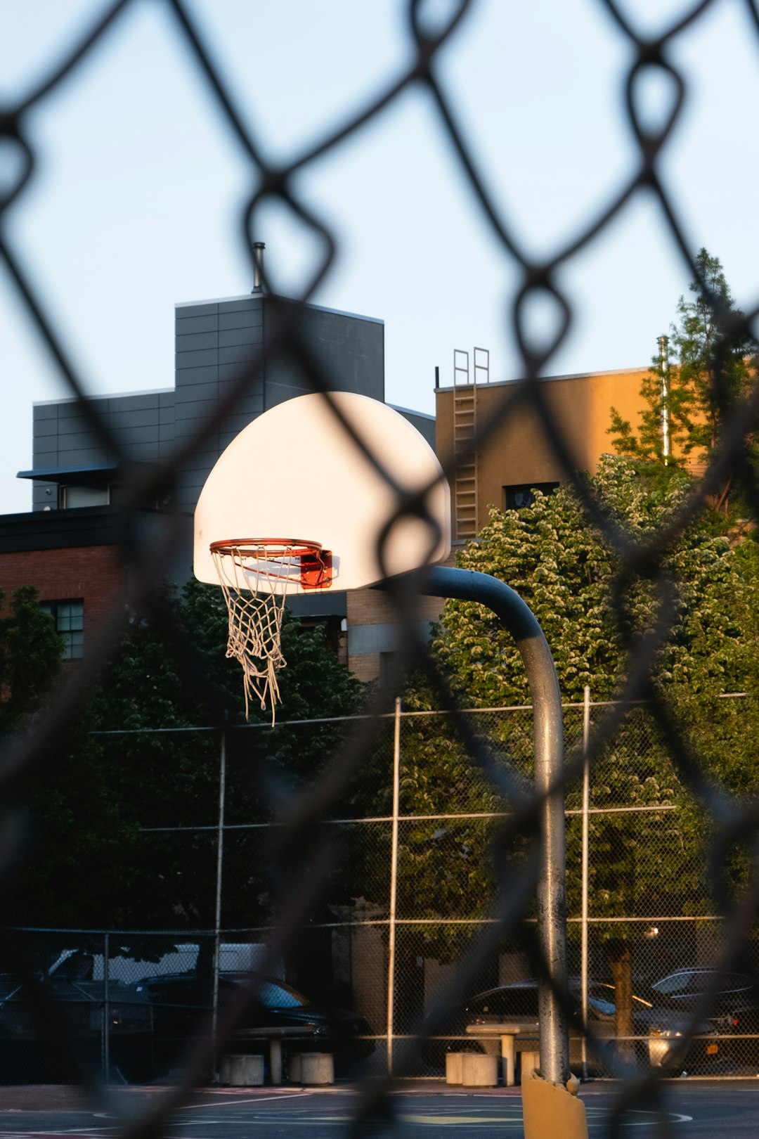 white and orange outdoor basketball hoop and board