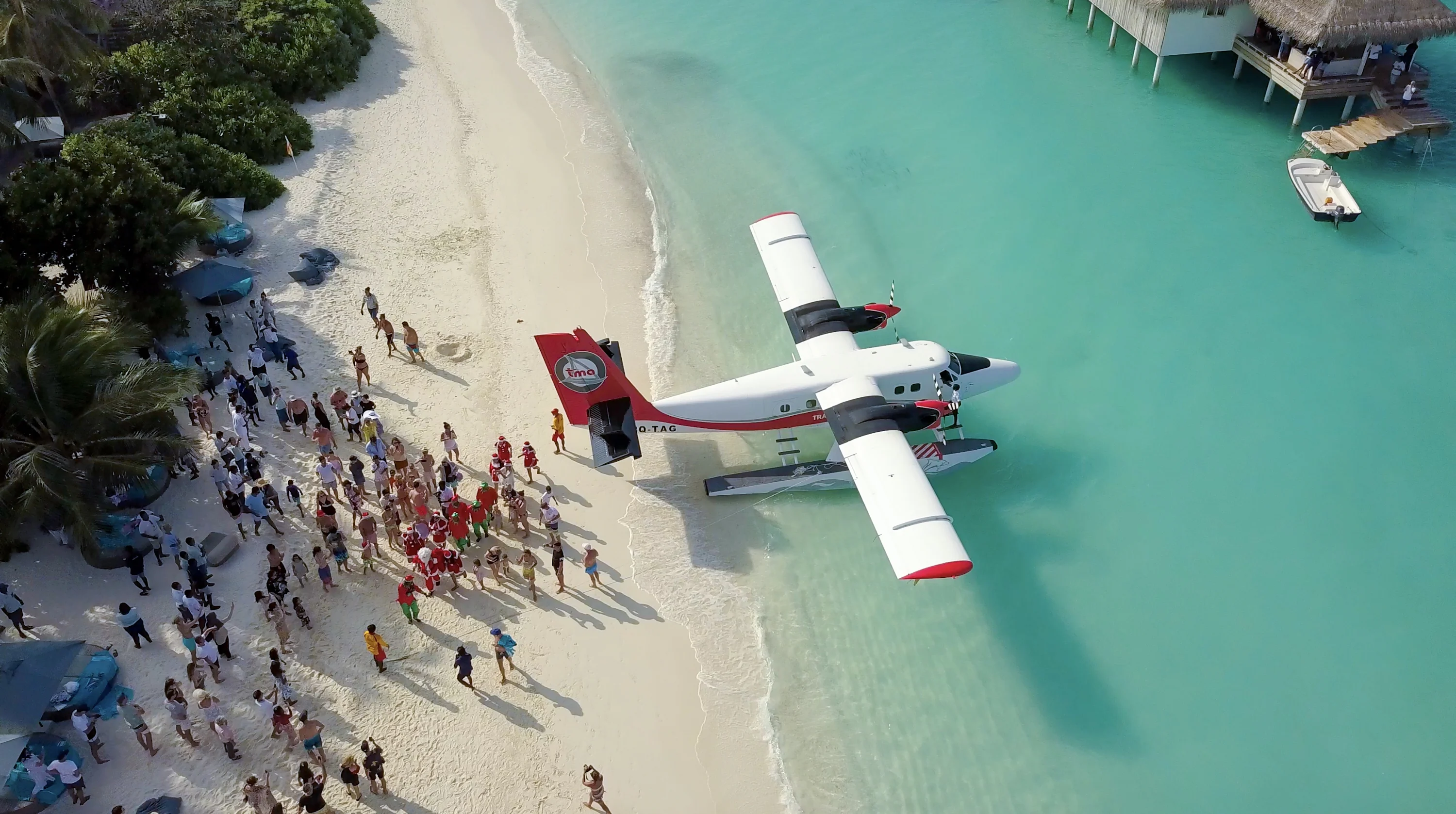 white and red airplane in seashore