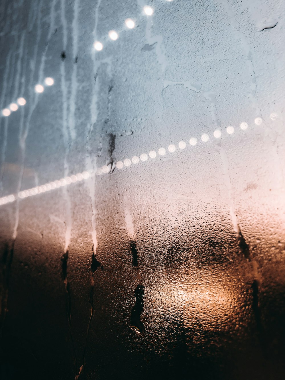 a window with rain drops on the glass