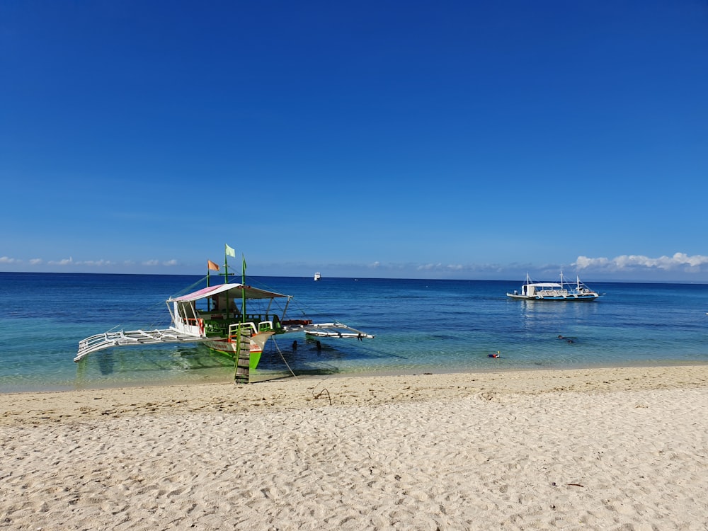 white boat during dayhtime