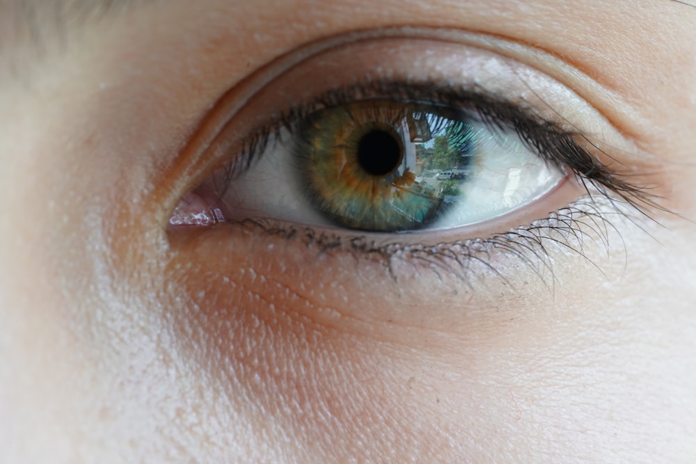 a close up of a person's blue eye