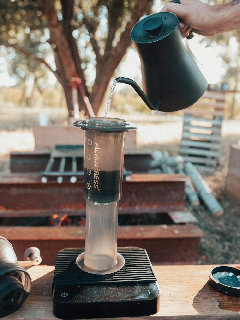 person holding black pitcher