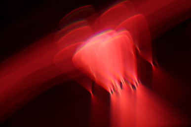 a blurry image of a red object in the dark