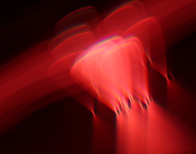 a blurry image of a red object in the dark