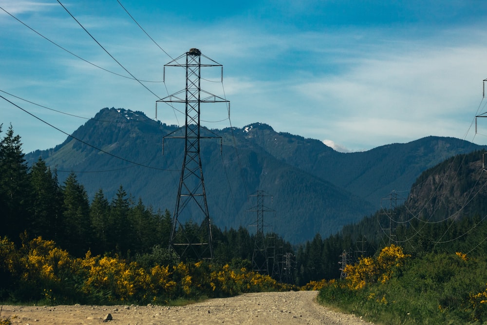 gray transformer post near mountain