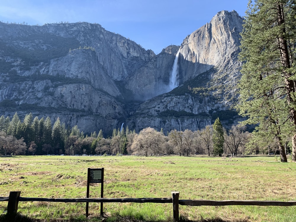 waterfalls on top of hill during daytime