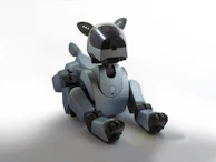 Realistic photo of a robotic dog sitting attentively on a modern office floor with cool lighting.