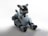A sleek robot dog performing tricks in a sunny park, showcasing its agility and responsiveness.