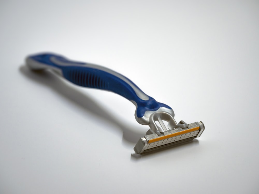 blue and silver Gillette razor