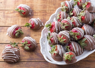 bowl of strawberry covered with chocolates